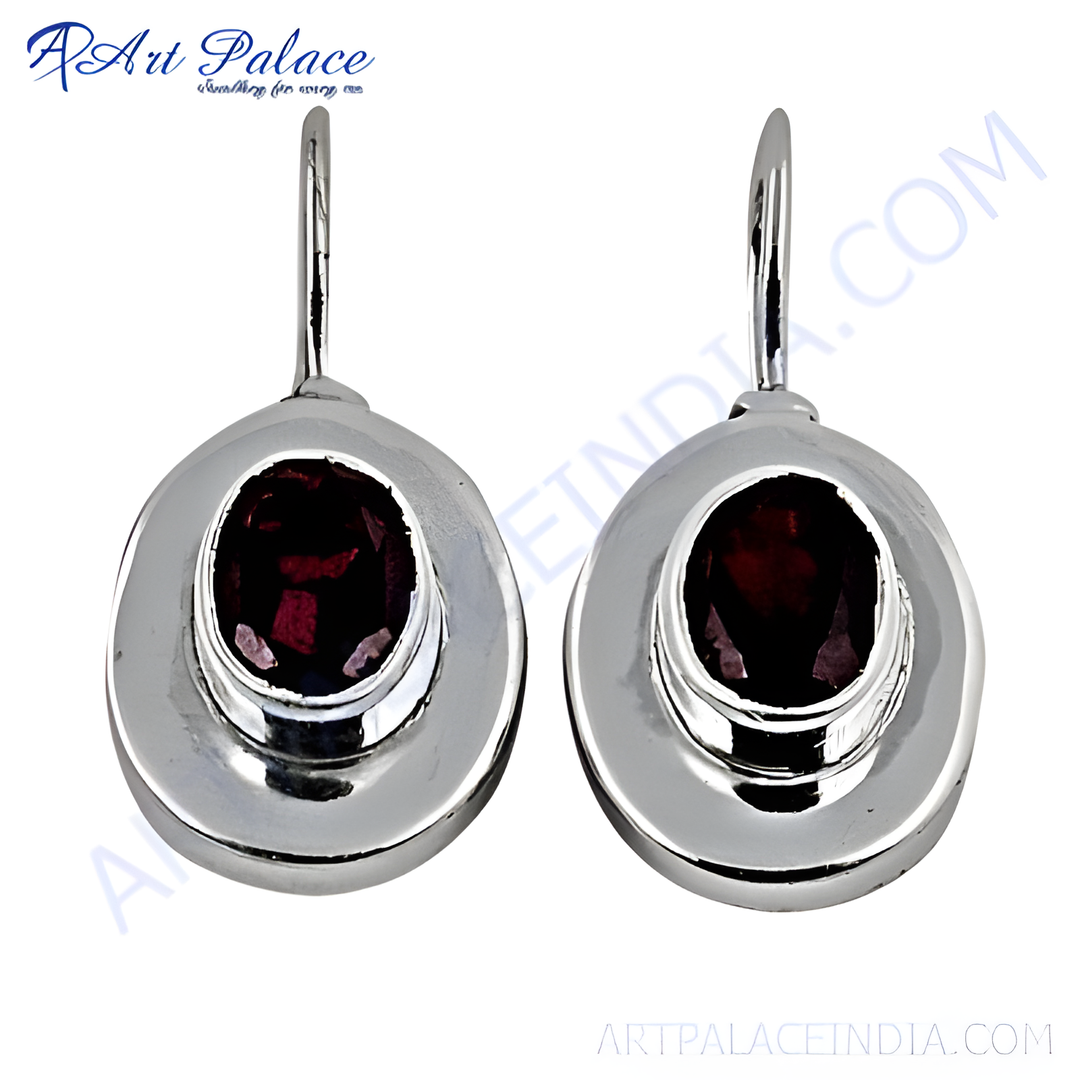 925 sterling silver drop earrings with oval-cut red garnet gemstones.
