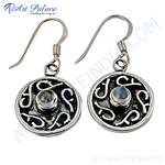 Load image into Gallery viewer, 925 sterling silver dangle earrings with a moonstone center and intricate Celtic knot design.
