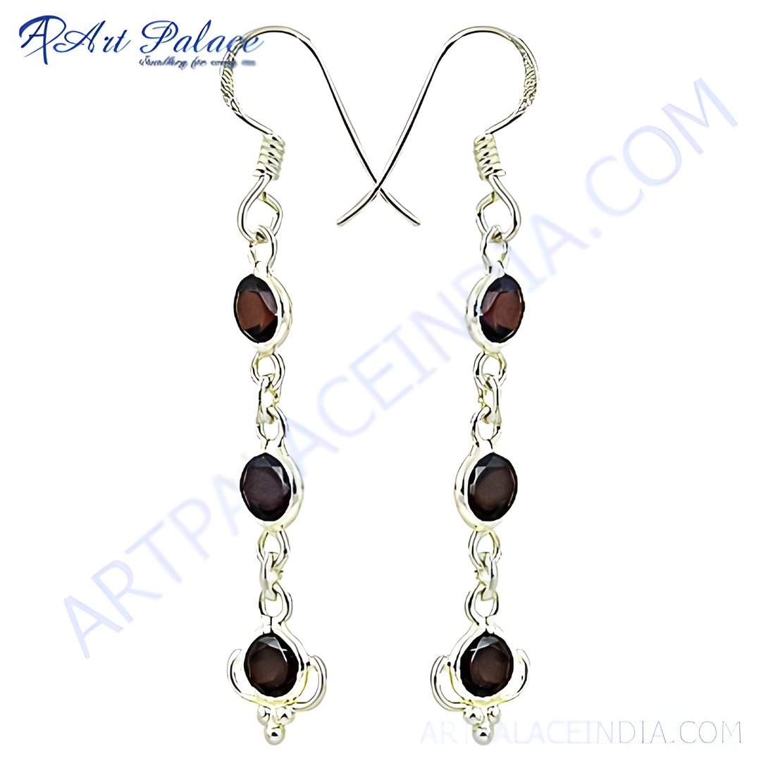 925 sterling silver drop earrings with oval-cut red garnet gemstones.