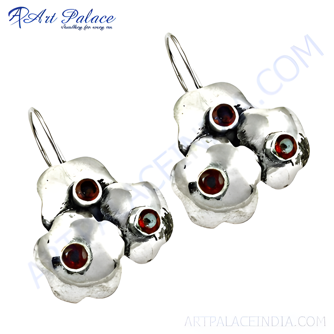 925 sterling silver dangle earrings with floral design and red garnet gemstones.