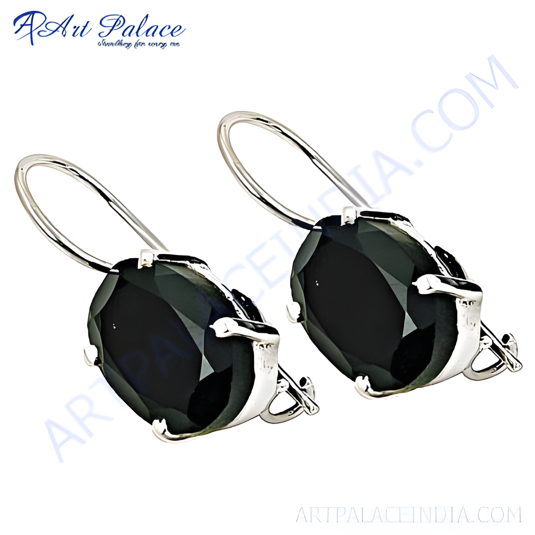Sterling silver drop earrings featuring oval-cut black onyx gemstones with a polished finish.