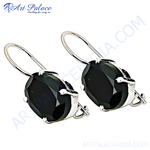 Load image into Gallery viewer, Sterling silver drop earrings featuring oval-cut black onyx gemstones with a polished finish.

