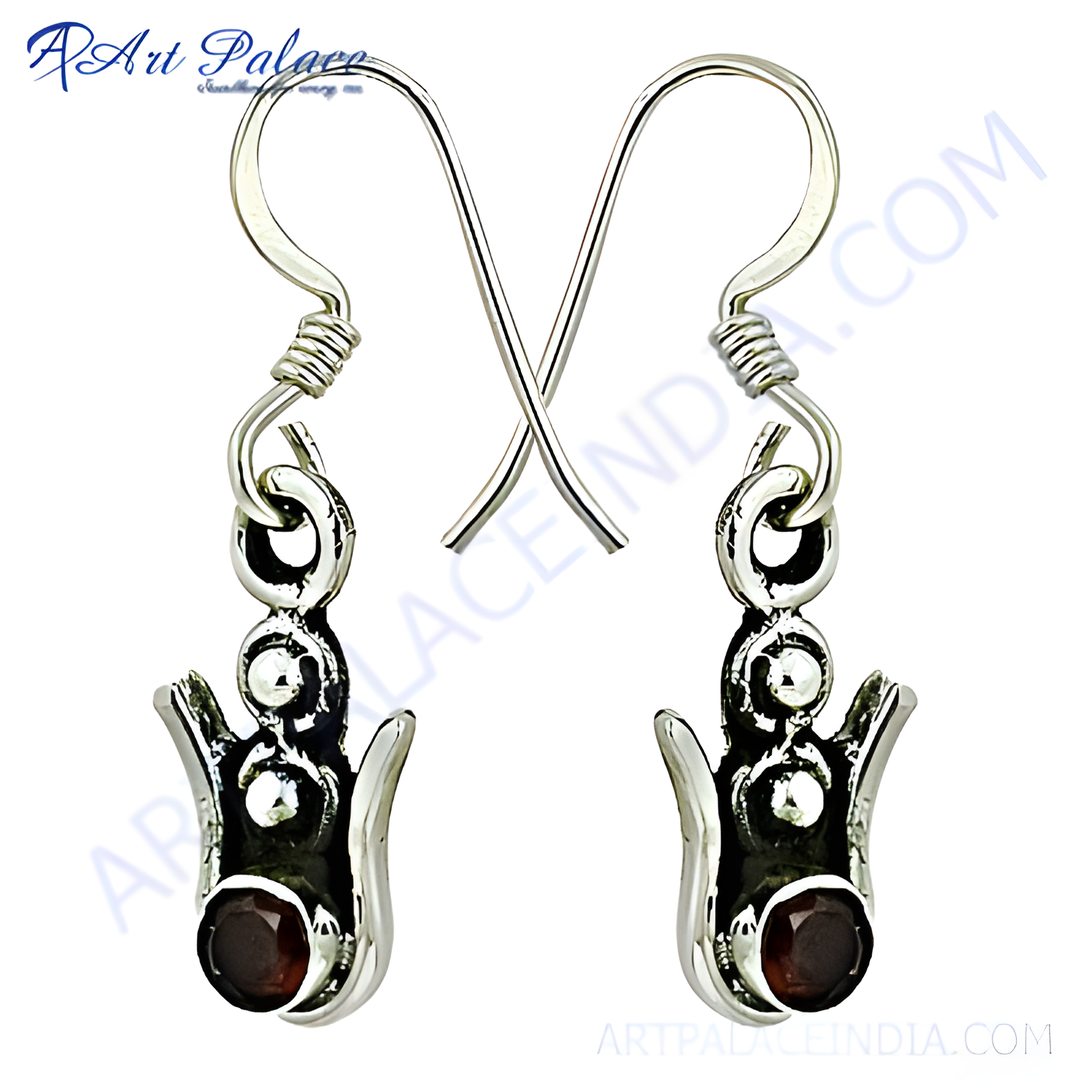 Sterling silver dangle earrings with round garnet gemstones, perfect for any occasion.