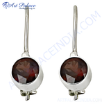 Load image into Gallery viewer, 925 sterling silver drop earrings with round, faceted red garnet gemstones.
