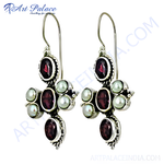 Load image into Gallery viewer, 925 sterling silver cross earrings with oval garnet gemstones and pearl accents.
