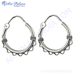 Load image into Gallery viewer, Sterling silver hoop earrings, a classic and elegant jewelry piece for women, featuring detailed design.

