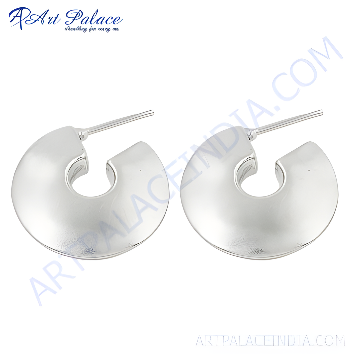 A pair of shiny silver half hoop earrings displayed on a white background