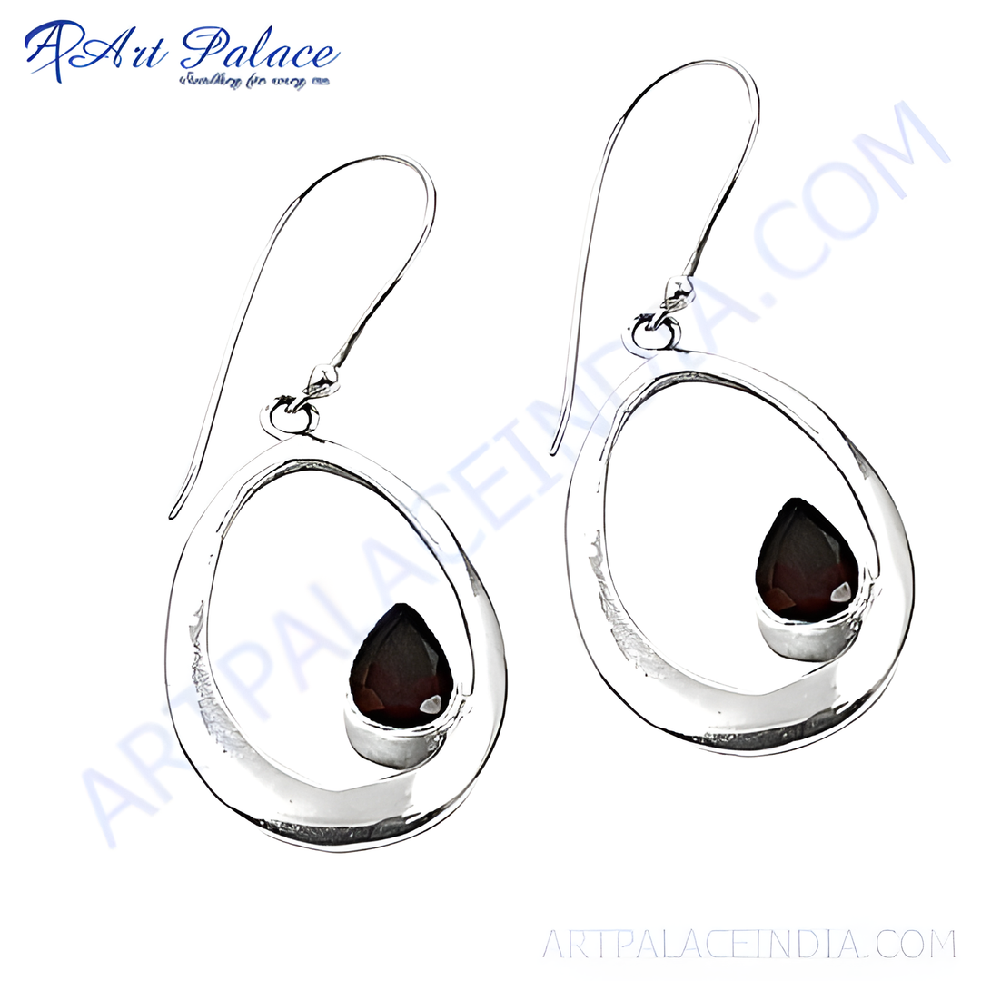 925 sterling silver dangle earrings with a teardrop design and a red garnet gemstone.