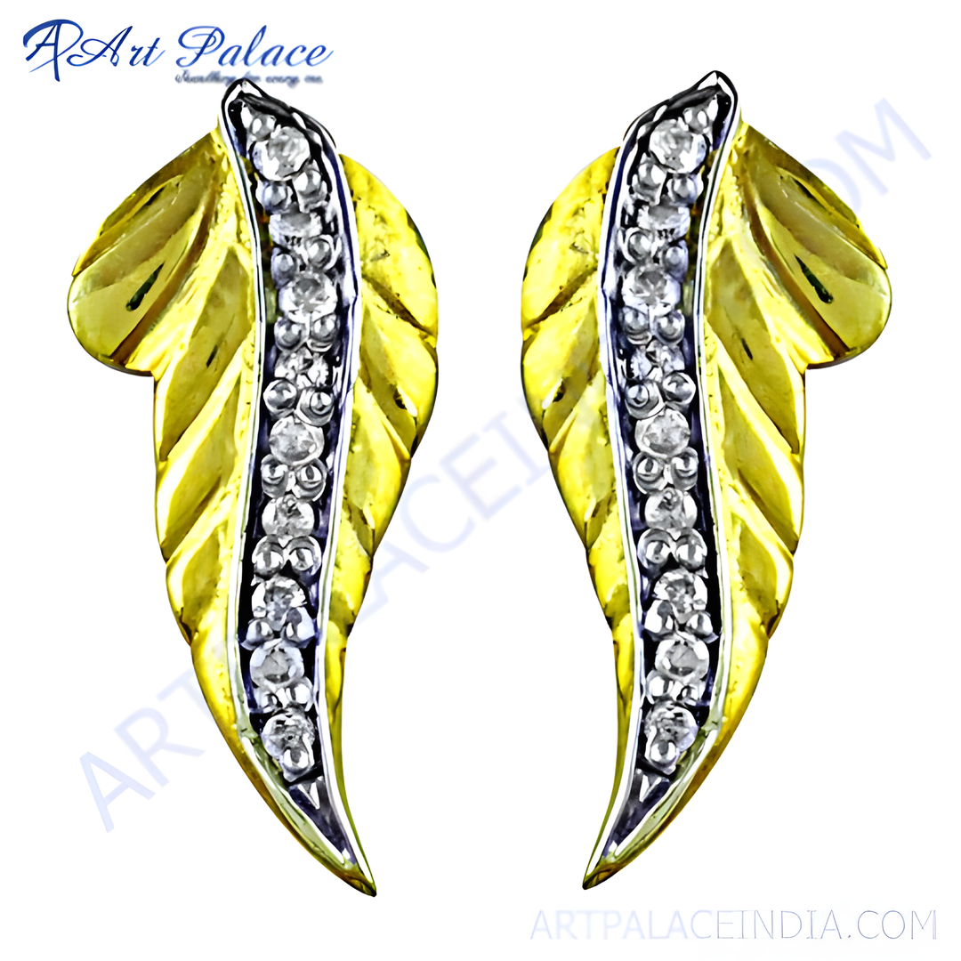 Gold leaf earrings with diamond accents, a luxurious jewelry piece.