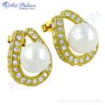 Load image into Gallery viewer, Gold stud earrings with white pearl center and cubic zirconia pave detailing
