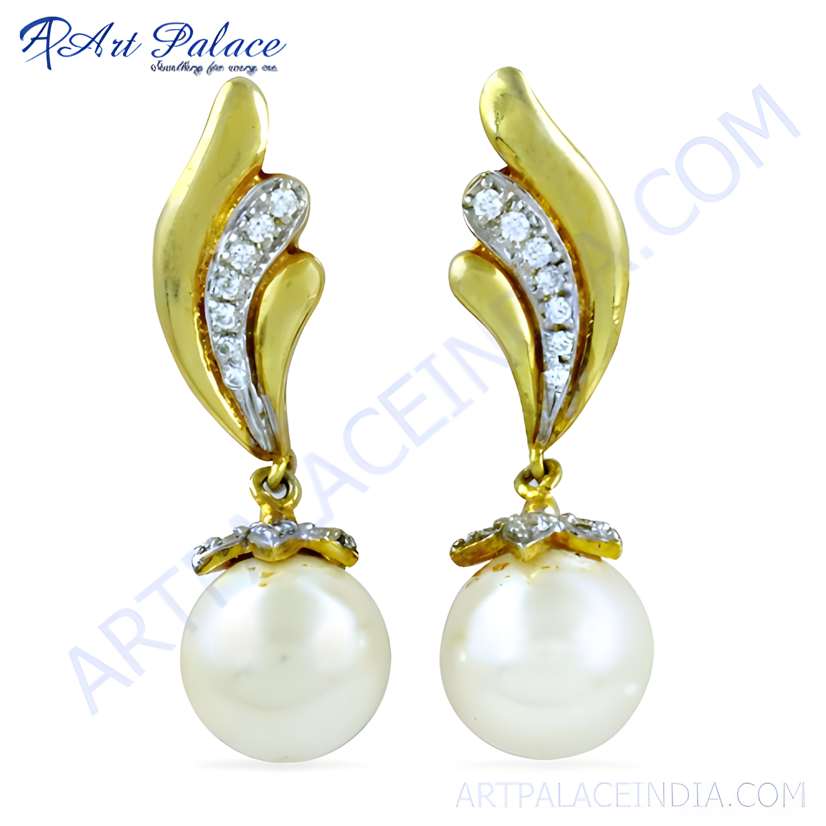 Gold drop earrings featuring a gold leaf design with crystals and a large pearl