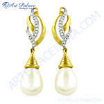 Load image into Gallery viewer, Gold drop earrings with white pearl drops and diamond accents, elegant jewelry for women.
