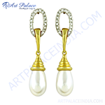 Load image into Gallery viewer, Gold drop earrings with white pearl drops and a diamond-like accent on top.
