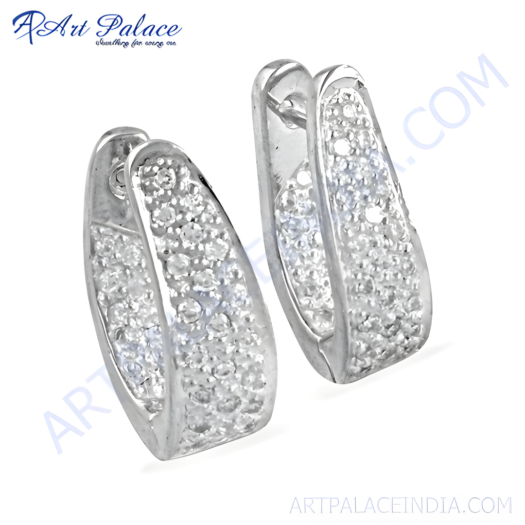 Silver hoop earrings with sparkling cubic zirconia stones for women. Dainty and elegant design.