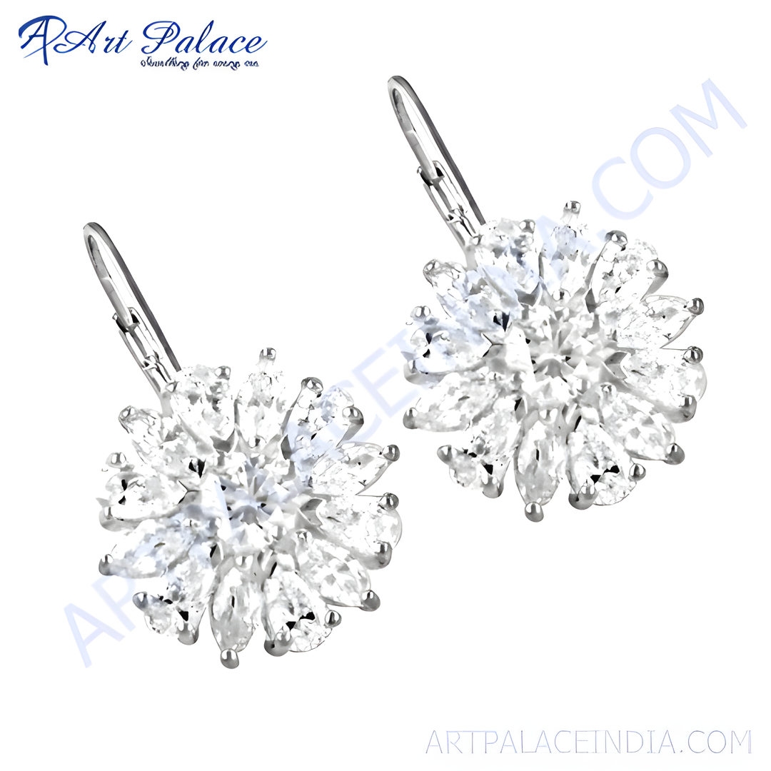 Silver dangle earrings with a flower design set with sparkling cubic zirconia stones.
