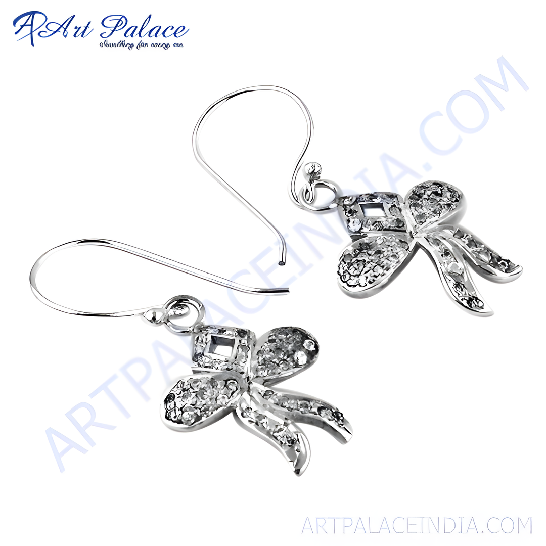 Silver bowknot earrings with sparkling clear cubic zirconia stones. Dangle style, elegant jewelry for women.