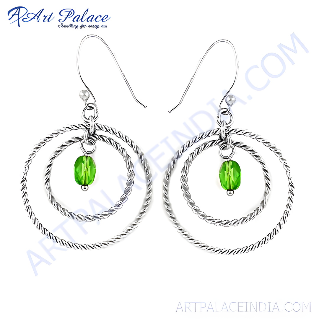 Sterling silver hoop earrings with green gemstone accents, a stylish and elegant jewelry piece.