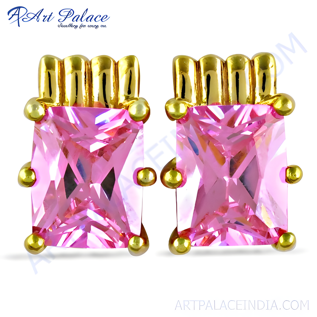 Gold stud earrings featuring vibrant pink gemstones, perfect for any occasion.