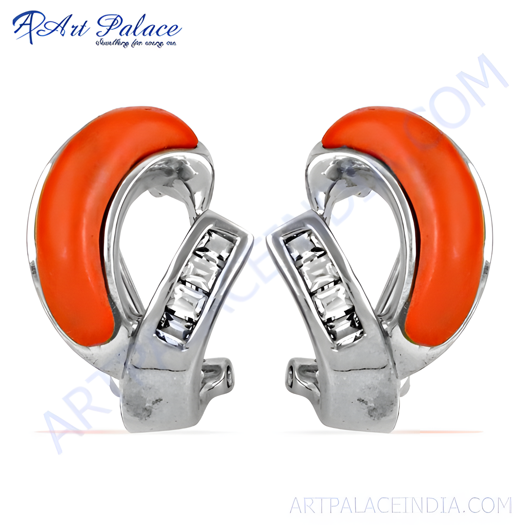 Sterling silver stud earrings with coral and cubic zirconia detail.