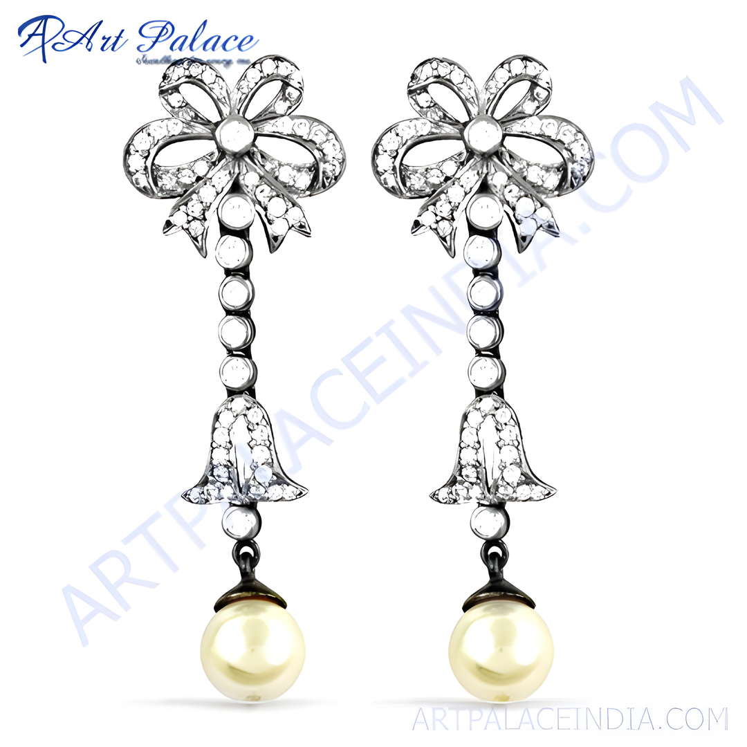Silver drop earrings with white pearls and sparkling cubic zirconia.