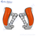 Load image into Gallery viewer, Silver stud earrings featuring orange enamel and sparkling cubic zirconia gemstones, perfect for women.
