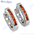 Load image into Gallery viewer, Sterling silver hoop earrings with a row of vibrant orange gemstones, perfect for any occasion.
