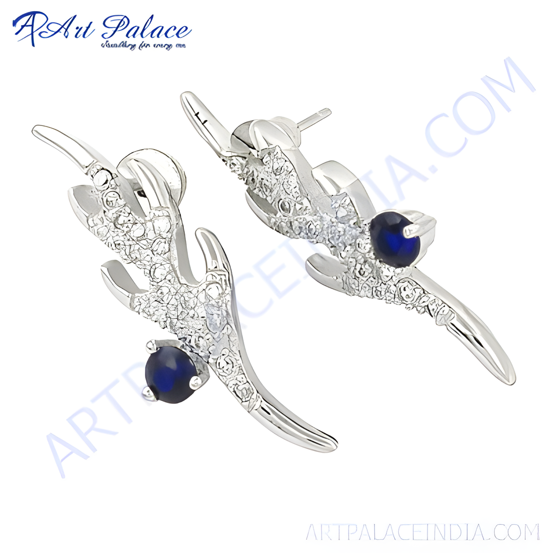 Sterling silver stud earrings with sparkling blue sapphire gemstones.