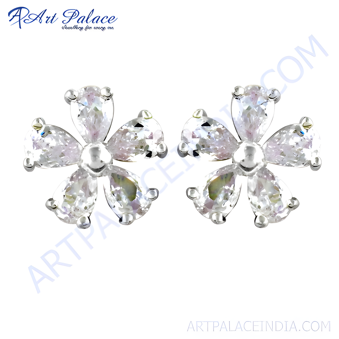 Sterling silver stud earrings with a flower design and clear cubic zirconia stones.