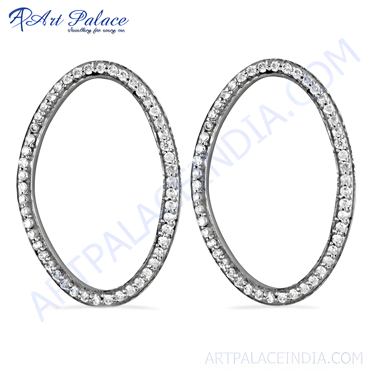 Silver oval hoop earrings with sparkling diamonds on a white background, showcasing elegant women's jewelry