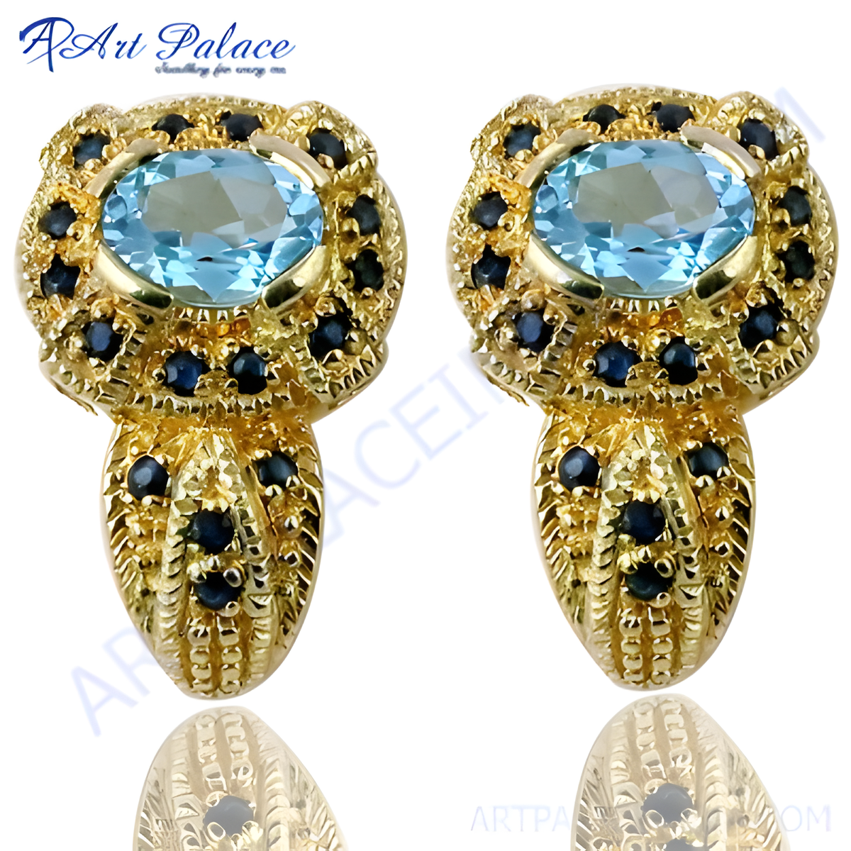 Gold stud earrings with a large oval blue topaz center stone and sapphire accents