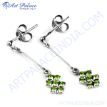 Load image into Gallery viewer, 925 sterling silver drop earrings with a cluster of vibrant green peridot gemstones.

