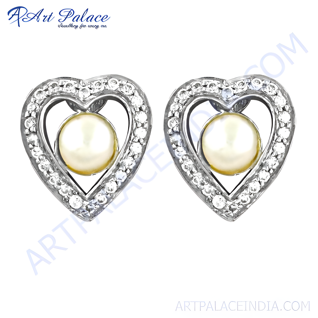 Sterling silver heart stud earrings with a pearl center and cubic zirconia accents, a lovely jewelry piece.