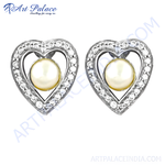 Load image into Gallery viewer, Sterling silver heart stud earrings with a pearl center and cubic zirconia accents, a lovely jewelry piece.
