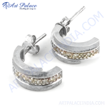 将图像加载到图库查看器中， Silver hoop earrings with a row of sparkling cubic zirconia stones set in a smooth band. The earrings are for women.
