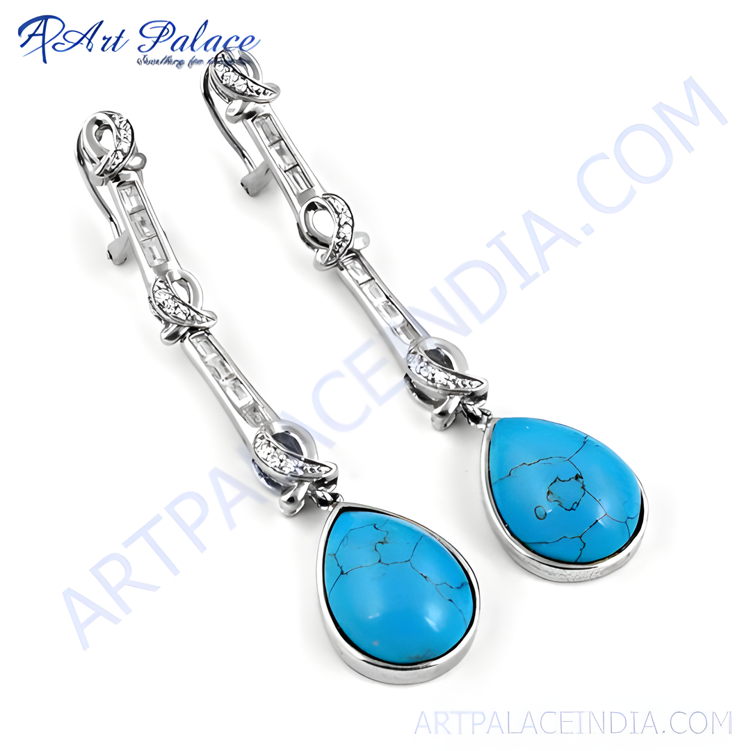 925 sterling silver dangle earrings with pear-shaped turquoise stones and cubic zirconia accents.