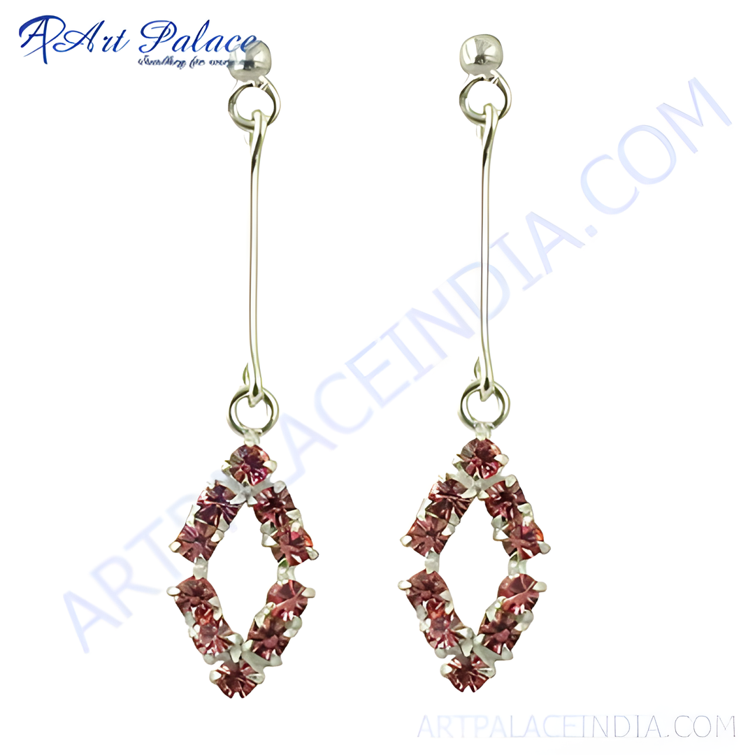 Silver drop earrings with a rhombus shape adorned with pink gemstones.