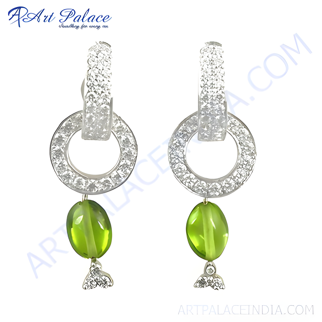 Silver dangle earrings featuring a green gemstone and sparkling clear stones, ideal for women.