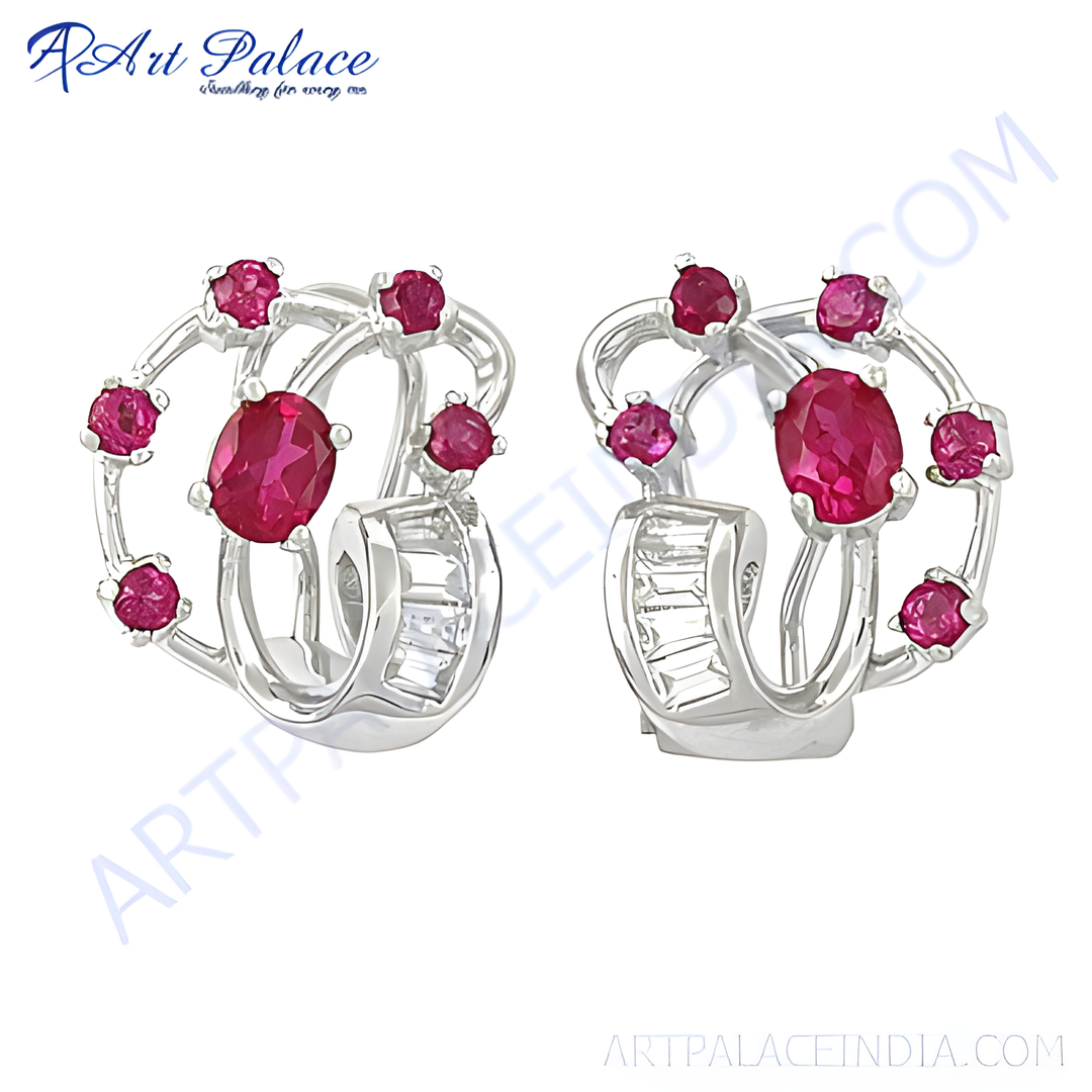 Silver dangle earrings with red ruby gemstones and sparkling diamonds, a perfect piece of luxury jewelry.
