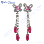 Load image into Gallery viewer, Silver dangle earrings with pink gemstones. Featuring a butterfly design with a chain and faceted pink gemstones.

