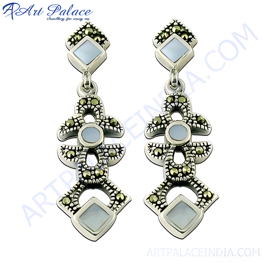 925 sterling silver dangle earrings with marcasite stones and mother of pearl accents. Silver earrings with a white background.