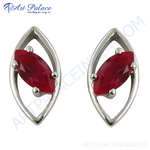 Load image into Gallery viewer, Sterling silver stud earrings with marquise-cut red ruby gemstones.
