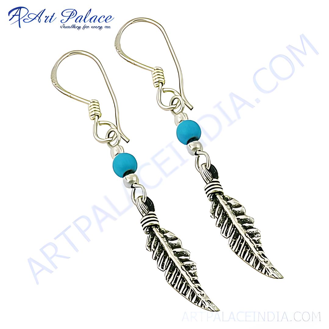 925 sterling silver dangle earrings featuring turquoise beads and feather design.