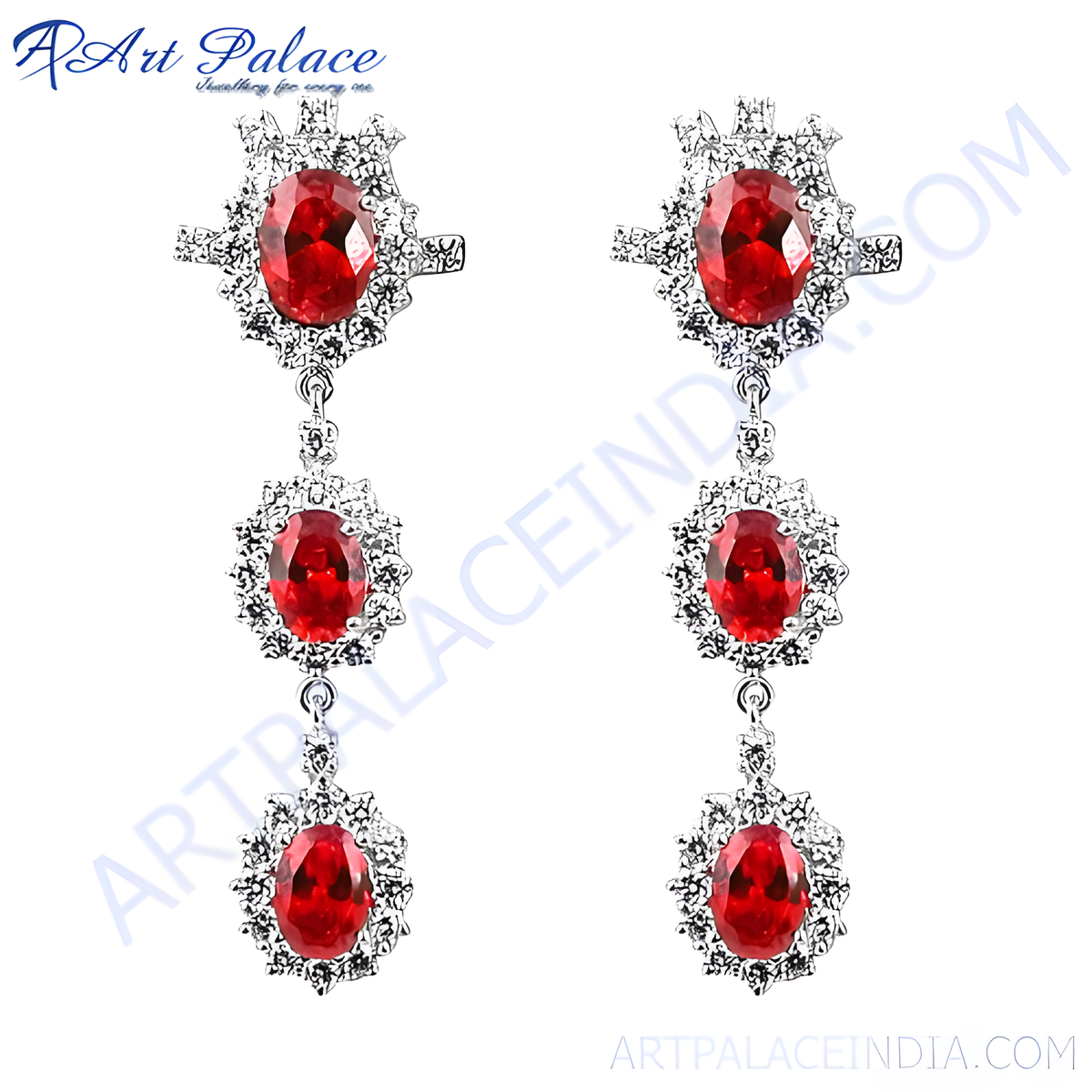 Silver drop earrings featuring vibrant red ruby gemstones