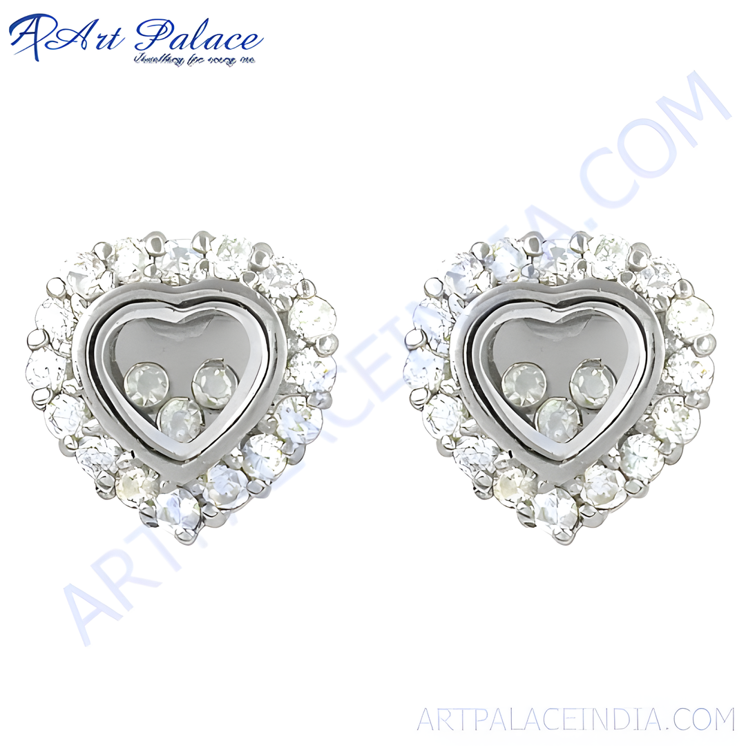 Silver heart-shaped stud earrings with a halo of white diamonds, featuring floating diamonds within the heart design.