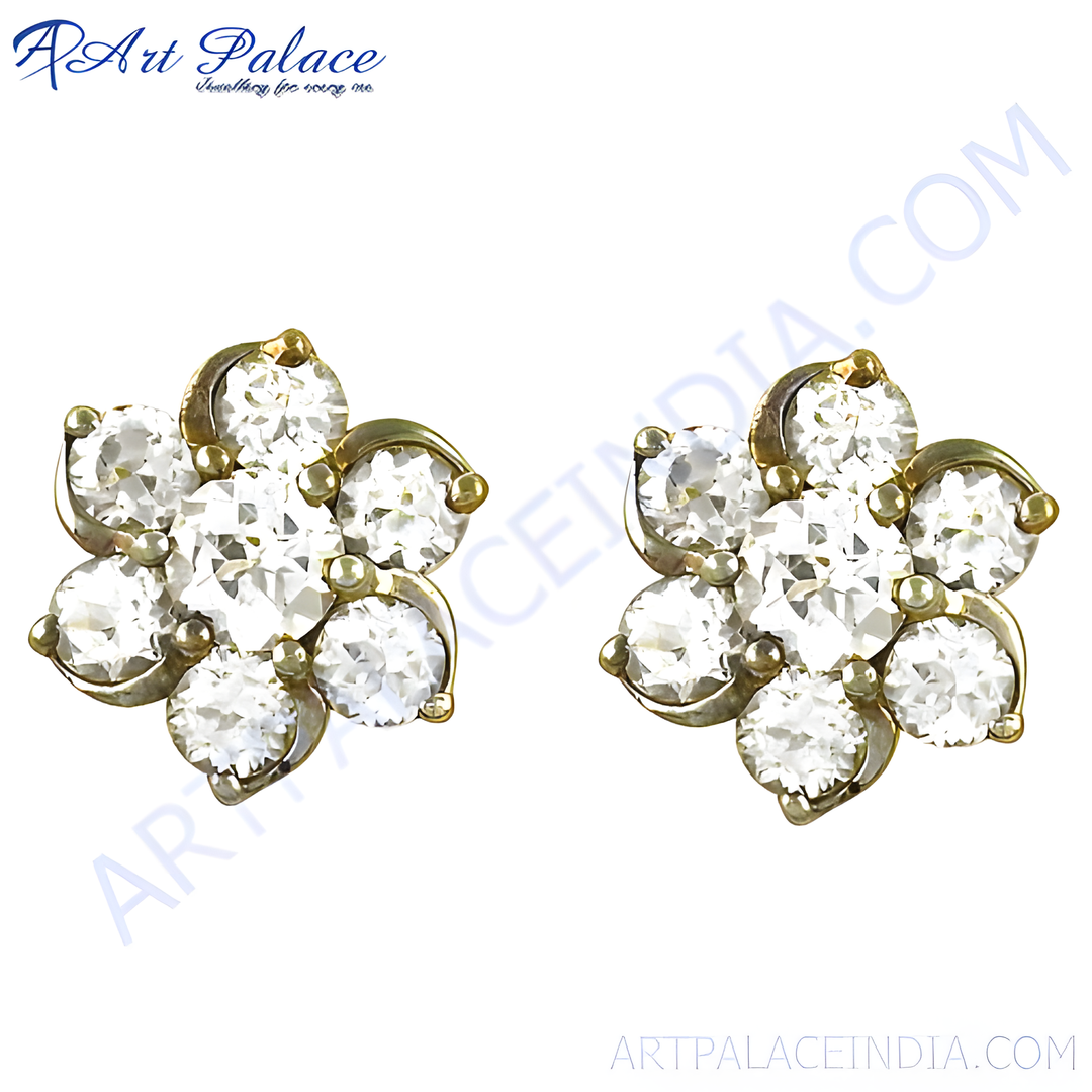 Gold flower stud earrings featuring multiple clear diamonds. Elegant, floral design perfect for women.