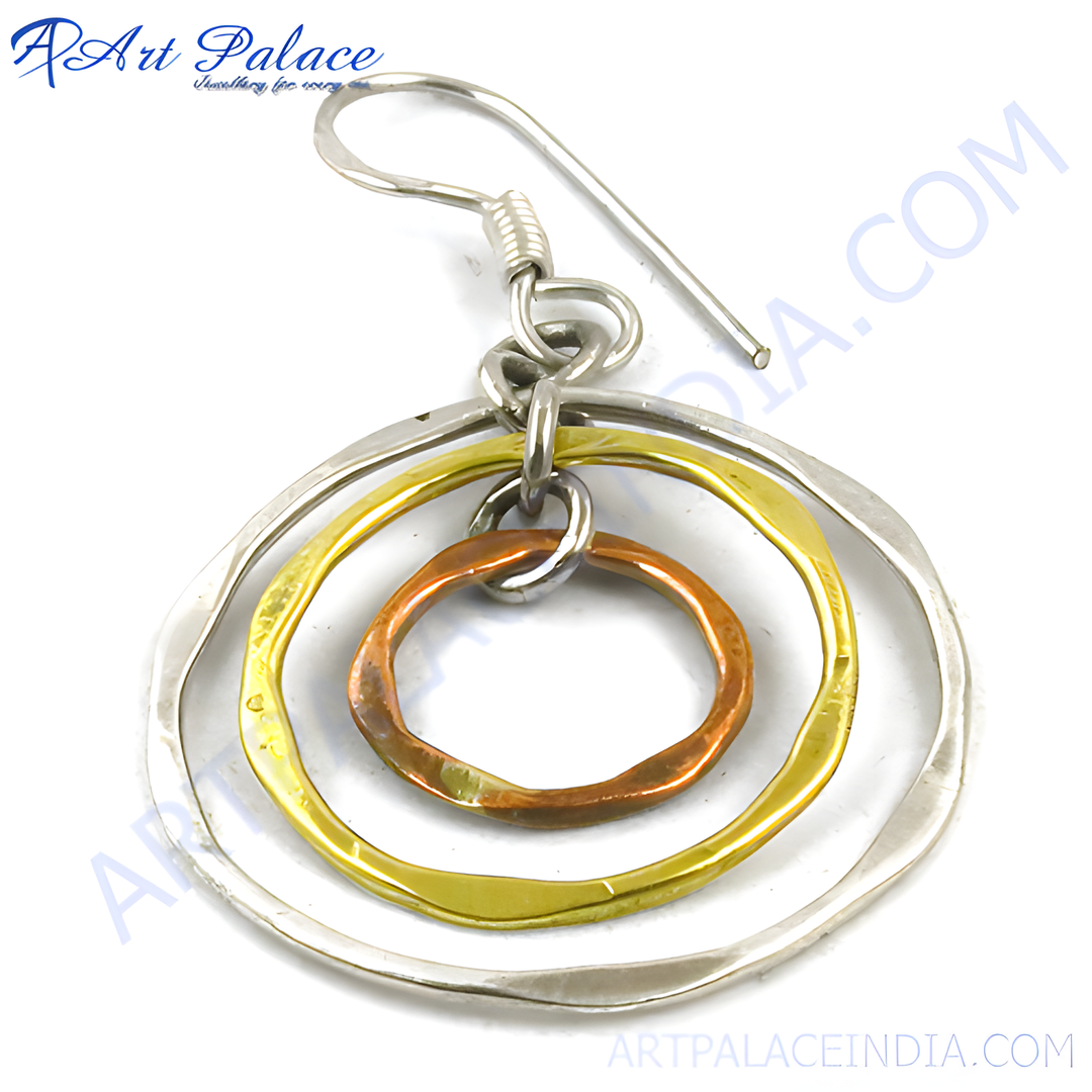 Mixed metal hoop earrings featuring silver, gold plating, and copper circles, a stylish and elegant jewelry design.