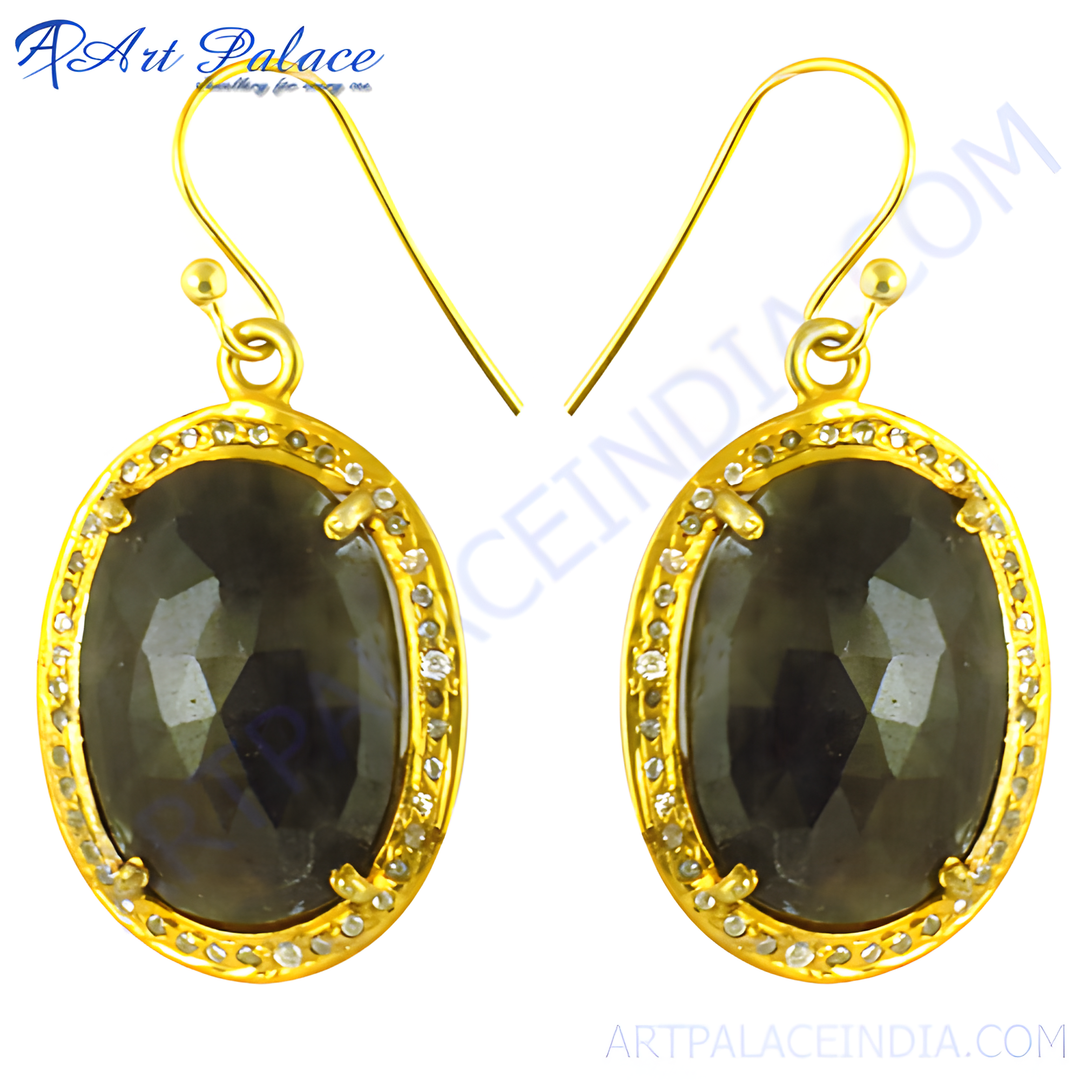 Gold drop earrings featuring oval-cut dark sapphire gemstones and diamond accents, luxury jewelry.