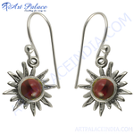Load image into Gallery viewer, 925 sterling silver dangle earrings with a sunburst design and a red gemstone center
