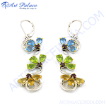 Load image into Gallery viewer, Sterling silver drop earrings featuring blue, green, and yellow gemstones in a floral design.
