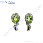 Load image into Gallery viewer, 925 sterling silver drop earrings with oval green peridot gemstones and sparkling accents
